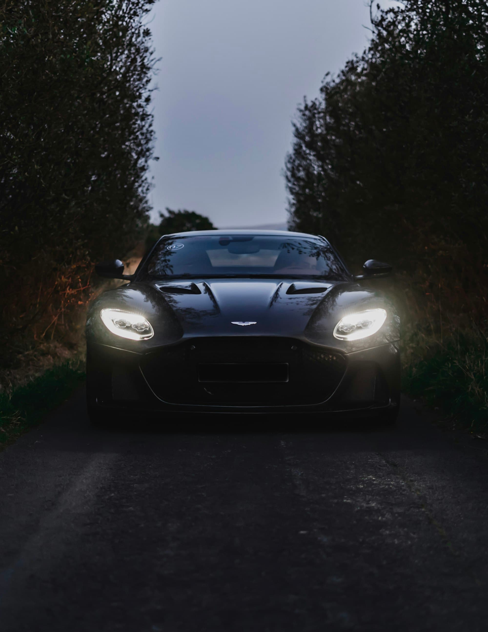Aston Martin DB12 Goldfinger Edition configurator interface, dark UI with brand-aligned typography
